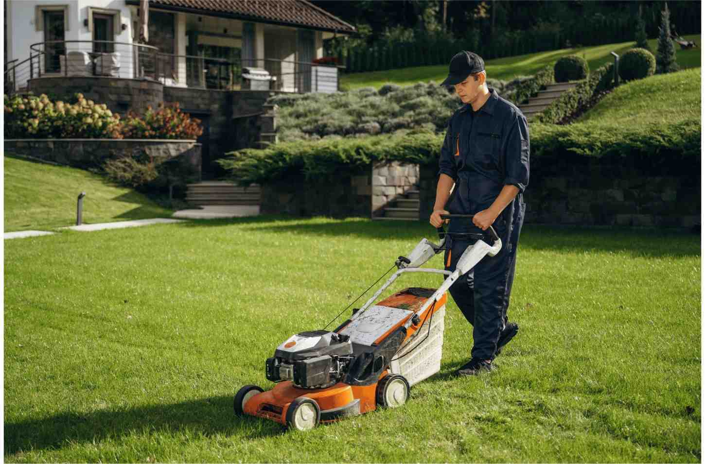Lawn Mower Maintenance Tips - Man Mowing Lawn - Push Mower | TLC